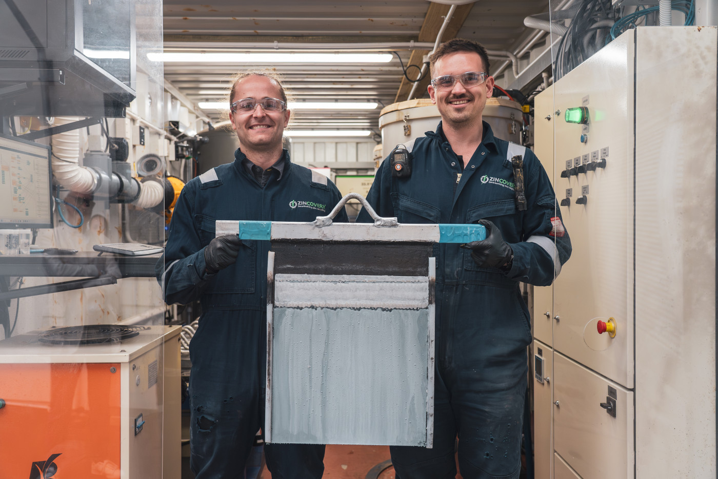 Two Zincovery team members standing in their Zinc recovery plant